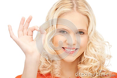 Lovely teenage girl showing ok sign Stock Photo