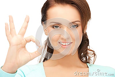 Lovely teenage girl showing ok sign Stock Photo