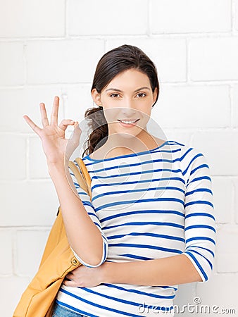 Lovely teenage girl showing ok sign Stock Photo