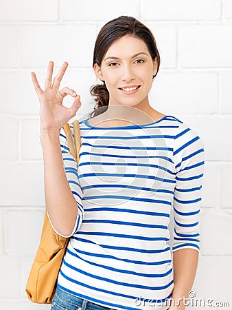 Lovely teenage girl showing ok sign Stock Photo