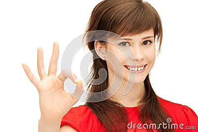 Lovely teenage girl showing ok sign Stock Photo