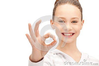 Lovely teenage girl showing ok sign Stock Photo