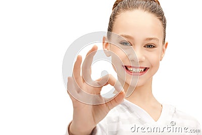 Lovely teenage girl showing ok sign Stock Photo