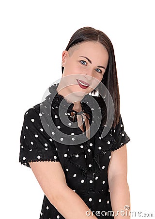 Smiling pretty woman in a pock dot dress Stock Photo