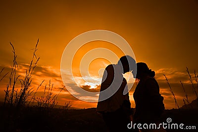 Lover couple in sunset background Stock Photo