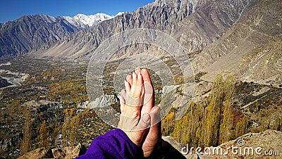 Lover hands touching and togethering with mountain and blue sky background for love and healing concept Stock Photo