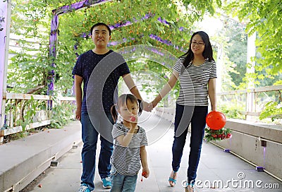 Happy family spouse husband or wife lover sweet beautiful parent and child relationship hand in hand enjoy free time summer park Stock Photo