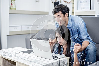 Lover are surprising when using the laptop. Family concept, Love Stock Photo