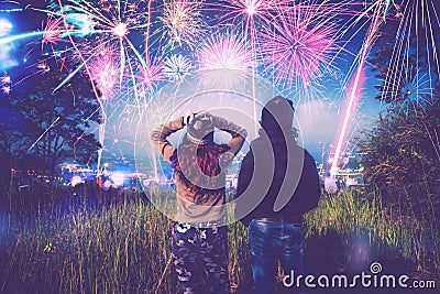 Lover women and men asians. Watch the fireworks. In New Year`s Mountain. Thailand Stock Photo