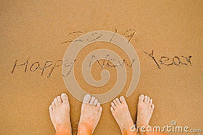 Lover Write 2019 happy new year on beach Stock Photo