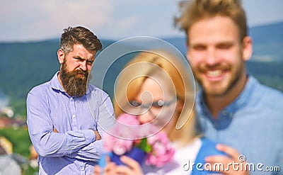 Lovers hugs outdoor flirt romance relations. Couple in love dating while jealous bearded man watching wife cheating him Stock Photo