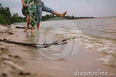 Couple play shore water splashes love clothes Stock Photo