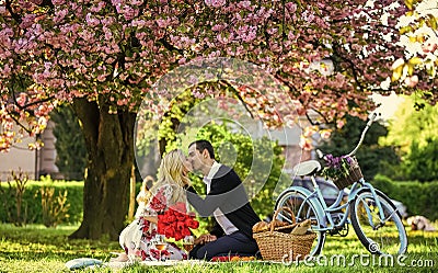 Lovers sensual kissing. Couple in love picnic date. Spring weekend. My treasure. Romantic proposal. Enjoying their Stock Photo