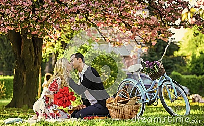 Lovers sensual kissing. My treasure. Romantic proposal. Enjoying their perfect date. Couple relaxing in park with Stock Photo