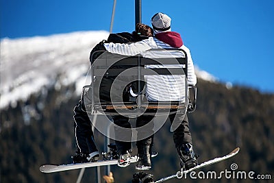 Lovers on Ski Lift Stock Photo