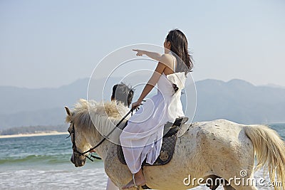 Lovers walking on beach Stock Photo