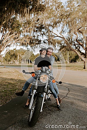 Loving Adorable Portrait of two Attractive Good Looking Young Adult Modern Fashionable People Guy Girl Couple Kissing and Hugging Stock Photo