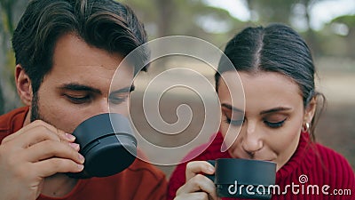 Loving couple drinking beverage at picnic on nature closeup. Romantic pair relax Stock Photo