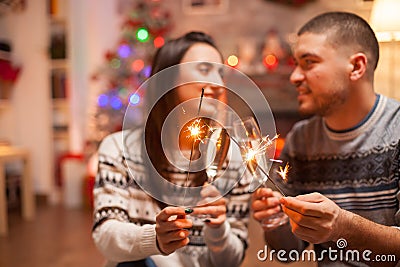 Loving couple with hand fireworks flicker brightly Stock Photo