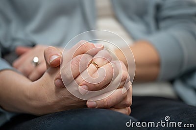 Loving couple holding hands during a teraphy session Stock Photo