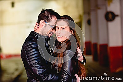 Loving couple loved embracing each other in a garden of a city hidden from prying eyes Stock Photo