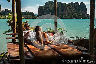 Loving couple resting in Asia. A young couple travels to exotic countries. Man and woman at the resort. Couple resting in Thailand Stock Photo