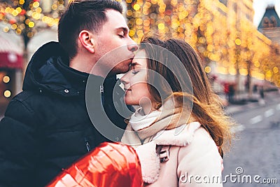 Loving couple on the street on christmas background Stock Photo