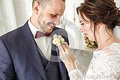 Loving couple of stylish newlyweds walks and kisses in the old city in summer sunny day Stock Photo