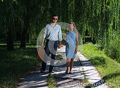 Loving couple walking hand-in-hand Stock Photo