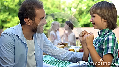 Loving daddy talking little son, family care and trustful relations, childhood Stock Photo