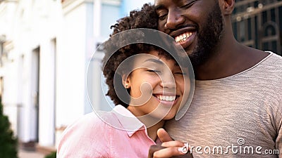 Loving girlfriend hugging boyfriend outdoors, tender relations, love closeness Stock Photo