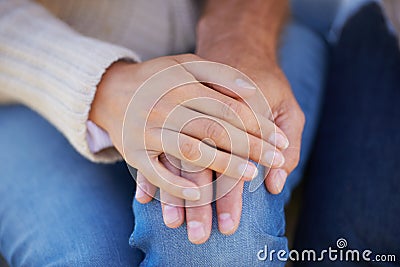 A loving hand. Cropped image of a woman placing her hand affectionately on top of her lovers. Stock Photo