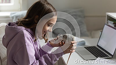 Loving teen girl play with domesticated mouse Stock Photo