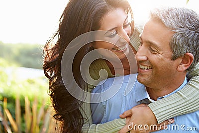 Loving Hispanic Couple In Countryside Stock Photo