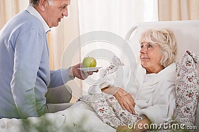 Loving husband and sick wife Stock Photo