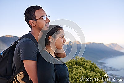 Loving Indian couple standing together on a nature hike Stock Photo