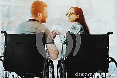 Loving Invalids Looking at Each Other near Window. Stock Photo