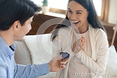 Loving man make marriage proposal to excited woman Stock Photo