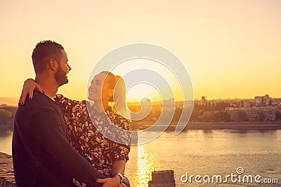 Loving man and womanoutdoor dating in sunset Stock Photo