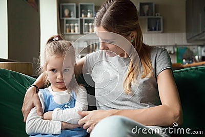 Loving mother consoling insulted upset stubborn kid daughter avo Stock Photo