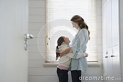 Loving Mother And Daughter Embracing Stock Photo