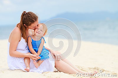 Loving mother and daughter on tropical beach Stock Photo