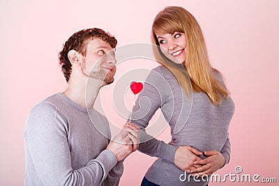 Loving pare with heart flirting. Stock Photo