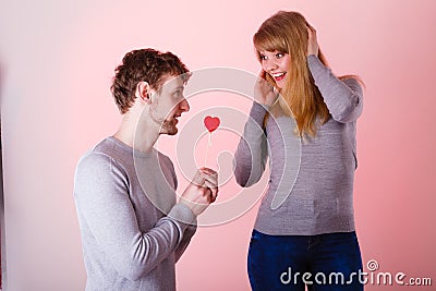 Loving pare with heart flirting. Stock Photo