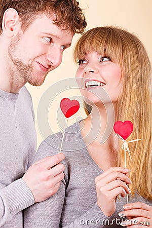 Loving pare with hearts flirting. Stock Photo