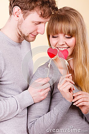 Loving pare with hearts flirting. Stock Photo