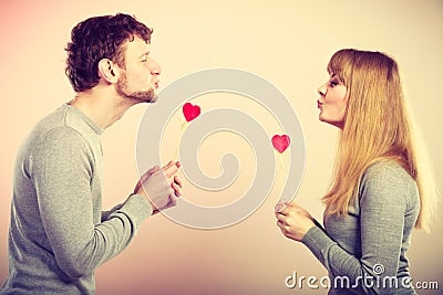 Loving pare with hearts flirting. Stock Photo