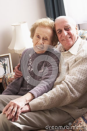 Loving Senior Couple Relaxing At Home Stock Photo