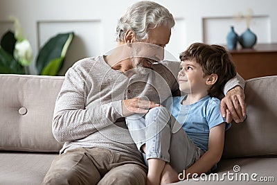 Loving senior grandfather enjoy weekend with small grandson Stock Photo