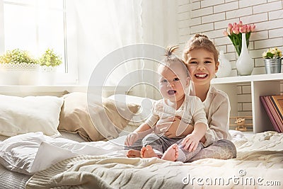 Loving sisters hug Stock Photo